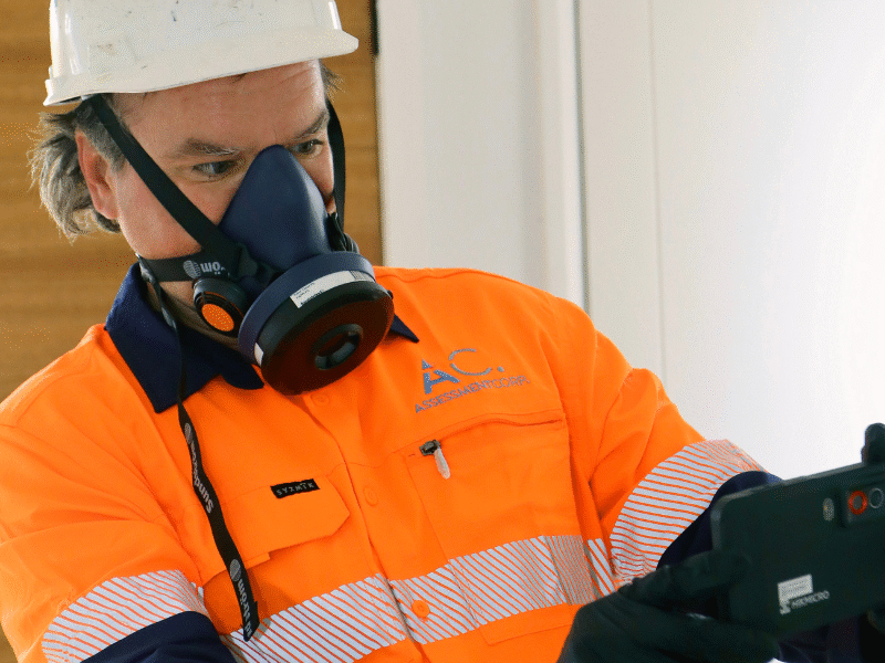 Certified mould testing specialist conducting indoor air and surface assessment in a Central Coast home.