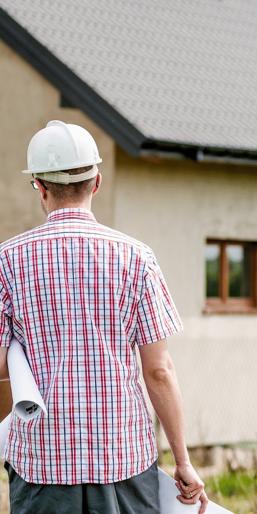 Environmental consultant conducting asbestos testing in a Central Coast home before renovation.